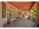Spacious covered patio with ample space for plants, decor, and outdoor seating, offering a relaxing ambiance at 7722 W Michigan Ave, Glendale, AZ 85308