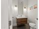 Powder room features a floating vanity with decorative lighting and neutral color palette at 7775 E Fledgling Dr, Scottsdale, AZ 85255