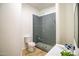 Contemporary bathroom showcasing a tiled shower and floating vanity at 7775 E Fledgling Dr, Scottsdale, AZ 85255