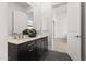Bathroom features a double sink vanity, marble countertops, and tile flooring at 7775 E Fledgling Dr, Scottsdale, AZ 85255