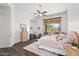 Inviting bedroom featuring hardwood floors, a plush bed, and elegant decor at 7775 E Fledgling Dr, Scottsdale, AZ 85255