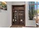 Custom wood bookcase featuring built in shelves at 7775 E Fledgling Dr, Scottsdale, AZ 85255