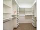 Spacious walk-in closet with built-in shelving and ample storage space at 7775 E Fledgling Dr, Scottsdale, AZ 85255