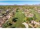 Scenic aerial view of a beautiful golf course with green fairways and desert landscape, surrounded by homes at 7775 E Fledgling Dr, Scottsdale, AZ 85255