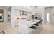 Modern kitchen featuring an island with seating and stainless steel appliances at 7775 E Fledgling Dr, Scottsdale, AZ 85255