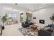 Inviting living room with a fireplace, open floorplan, tile floors, and stylish decor at 7775 E Fledgling Dr, Scottsdale, AZ 85255