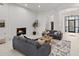 Open living room displaying modern fireplace, neutral decor, and bright open doorway at 7775 E Fledgling Dr, Scottsdale, AZ 85255