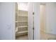Pantry with white shelves and door open, showing ample storage space at 7775 E Fledgling Dr, Scottsdale, AZ 85255