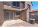 Cozy back patio area with security door and window, and external access to what appears to be a storage room at 8111 W Wacker Rd # 94, Peoria, AZ 85381