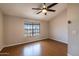 Neutral bedroom with wood floor, vaulted ceiling and ceiling fan for a comfortable space at 8111 W Wacker Rd # 94, Peoria, AZ 85381