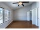 Bedroom with wood floor, vaulted ceiling, and two windows providing natural light at 8111 W Wacker Rd # 94, Peoria, AZ 85381