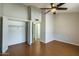 Bedroom with wood floor, closet and ceiling fan for a comfortable space at 8111 W Wacker Rd # 94, Peoria, AZ 85381