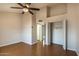 Neutral bedroom with closet, wood floor and ceiling fan for a comfortable space at 8111 W Wacker Rd # 94, Peoria, AZ 85381