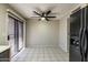 Kitchen eating area with tile floors, ceiling fan, and a sliding glass door to the backyard at 8111 W Wacker Rd # 94, Peoria, AZ 85381