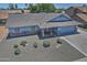 Aerial view of home with well-manicured landscaping, pool, and spacious driveway showcasing the neighborhood at 927 N Somerset Cir, Mesa, AZ 85205