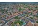 Aerial view of home with refreshing pool in a mature neighborhood close to a golf course at 927 N Somerset Cir, Mesa, AZ 85205