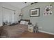 Bedroom featuring carpeted floors, a window for natural light, and quirky decor at 927 N Somerset Cir, Mesa, AZ 85205