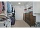 Organized walk-in closet featuring built-in shelving, rods, and ample storage space for clothes and accessories at 927 N Somerset Cir, Mesa, AZ 85205