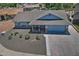 Charming single-Gathering home featuring a spacious driveway, well-maintained landscaping, and a welcoming facade at 927 N Somerset Cir, Mesa, AZ 85205