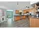 Bright kitchen featuring stainless steel appliances, wooden cabinetry, and tile floors at 927 N Somerset Cir, Mesa, AZ 85205