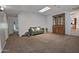 Cozy living room with comfortable seating, a skylight, and a classic china cabinet at 927 N Somerset Cir, Mesa, AZ 85205