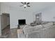 Comfortable living room featuring a large sectional sofa, ceiling fan, and tile floors at 927 N Somerset Cir, Mesa, AZ 85205