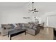Open concept living room and dining area boasts neutral tones, modern lighting, and tile flooring at 9322 E Jenan Dr, Scottsdale, AZ 85260