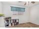 Bedroom featuring carpet flooring and a small window next to the shelves at 1004 E Gemini Dr, Tempe, AZ 85283