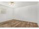 Cozy bedroom featuring white walls and a ceiling fan above carpet floors at 1004 E Gemini Dr, Tempe, AZ 85283