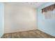 Neutral carpeted bedroom with one window and blue walls at 1004 E Gemini Dr, Tempe, AZ 85283