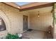 Inviting front porch with brick accents and security features at 1004 E Gemini Dr, Tempe, AZ 85283