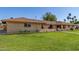 Charming single-story brick home with well-maintained lawn and arched entryway at 1004 E Gemini Dr, Tempe, AZ 85283
