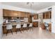 Eat-in kitchen with lots of wooden cabinets and breakfast bar at 1004 E Gemini Dr, Tempe, AZ 85283