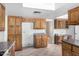 Functional kitchen with wood cabinets and tile floors at 1004 E Gemini Dr, Tempe, AZ 85283