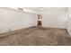 Large living room with carpet flooring, with a view of the home's kitchen at 1004 E Gemini Dr, Tempe, AZ 85283