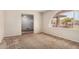 Open floor plan featuring a picture window and neutral tones at 1004 E Gemini Dr, Tempe, AZ 85283