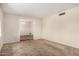 Spacious living room featuring neutral walls and carpet flooring throughout at 1004 E Gemini Dr, Tempe, AZ 85283