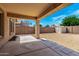 Covered patio looking out to a spacious backyard with a storage shed at 10934 W Almeria Rd, Avondale, AZ 85392