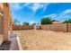 Backyard view featuring a storage shed, with block wall perimeter at 10934 W Almeria Rd, Avondale, AZ 85392