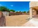 Expansive backyard featuring a storage shed and block wall fencing at 10934 W Almeria Rd, Avondale, AZ 85392