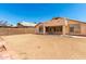 Backyard showcasing a covered patio and potential for landscaping at 10934 W Almeria Rd, Avondale, AZ 85392