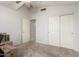 Bedroom featuring plush carpet, ceiling fan and access to the closet at 10934 W Almeria Rd, Avondale, AZ 85392
