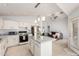 Spacious kitchen with granite countertops, stainless steel appliances, and open access to the living room at 10934 W Almeria Rd, Avondale, AZ 85392