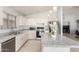 Modern kitchen with granite countertops, stainless steel appliances, and ample cabinet space at 10934 W Almeria Rd, Avondale, AZ 85392