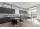 Well-lit activity room features ample counter space, cabinets, and tables, ideal for creative projects and gatherings at 1166 W Silver Creek Ln, Queen Creek, AZ 85140