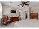 Cozy bedroom featuring carpet floors and a wooden dresser with decorative details at 1166 W Silver Creek Ln, Queen Creek, AZ 85140