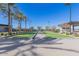 Manicured bocce ball court with landscaping and lighting, creating an inviting outdoor recreational space at 1166 W Silver Creek Ln, Queen Creek, AZ 85140
