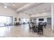 Spacious common area with tables, chairs, and modern décor, perfect for community gatherings and events at 1166 W Silver Creek Ln, Queen Creek, AZ 85140