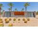 Ovation at Meridian entrance featuring desert landscaping, stone walls and palm trees at 1166 W Silver Creek Ln, Queen Creek, AZ 85140