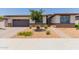 Charming single-story home featuring low-maintenance desert landscaping and a two-car garage at 1166 W Silver Creek Ln, Queen Creek, AZ 85140